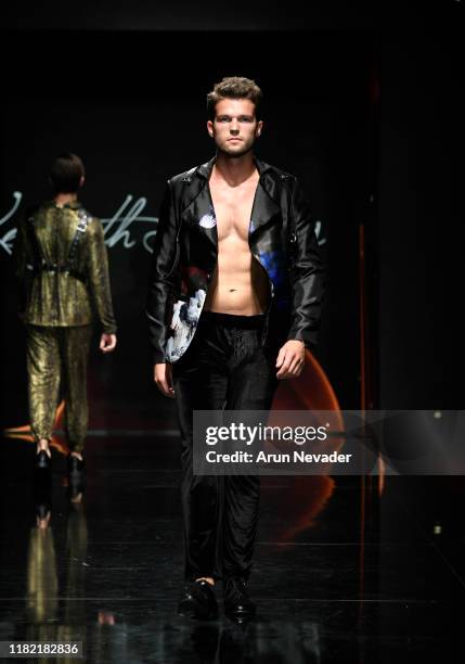 Model walks the runway wearing Kenneth Barlis during Los Angeles Fashion Week SS/20 Powered by Art Hearts Fashion on October 19, 2019 in Los Angeles,...