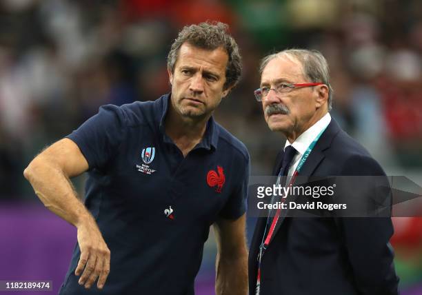 Jacques Brunel, Head Coach of France and Assistant Coach Fabien Galthie look on prior to the Rugby World Cup 2019 Quarter Final match between Wales...