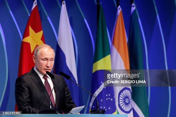Russia's President Vladimir Putin speaks during the BRICS Business Council, prior to the 11th edition of the BRICS Summit, in Brasilia, on November...