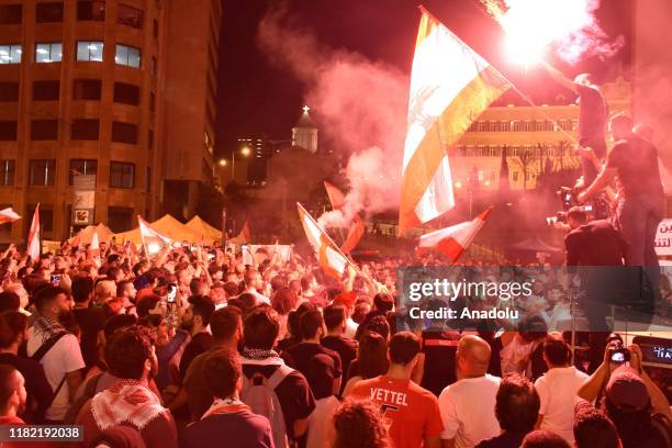 Protesters take part in the ongoing anti-government protest in Beirut, Lebanon on November 13, 2019.