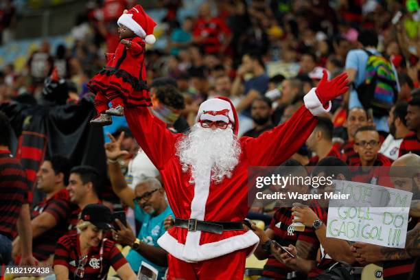 Flamengo fan dressed as Santa Claus poses before the match between Flamengo and Vasco as part of Brasileirao Seria A 2019 at Maracana Stadium on...