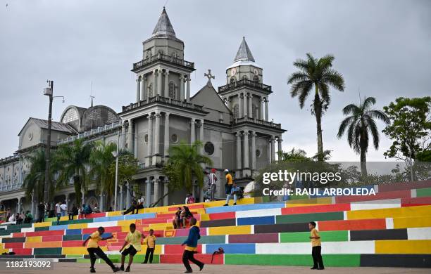 Boys play football by the San Francisco de Asis Cathedral in Quibdo, Choco department, Colombia, on November 13, 2019.