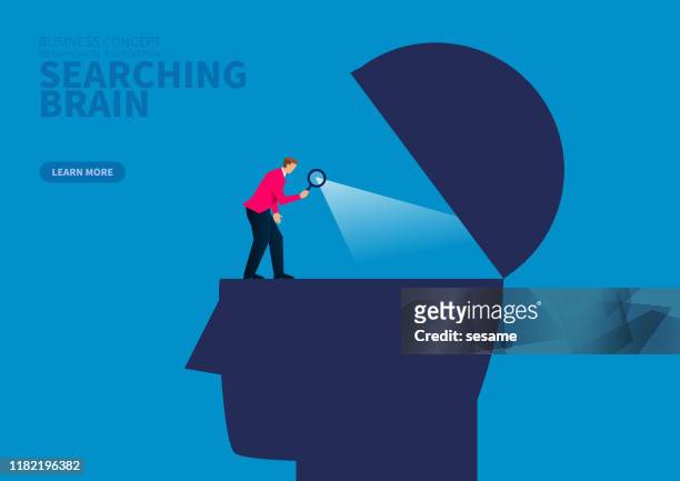 businessman holding magnifying glass to explore brain - human brain stock illustrations