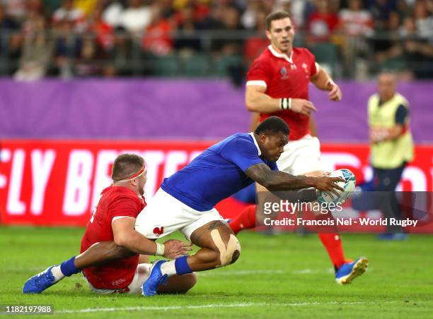 Virimi Vakatawa of France goes over to score his sides third try during the Rugby World Cup 2019 Quarter Final match between Wales and France at Oita...