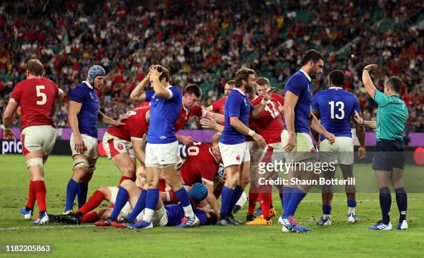 Ross Moriarty of Wales scores his sides second try as his teammates celebrate during the Rugby World Cup 2019 Quarter Final match between Wales and...