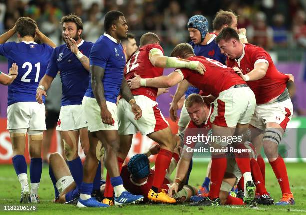 Ross Moriarty of Wales is congratulated by teammates after scoring his team's second try during the Rugby World Cup 2019 Quarter Final match between...