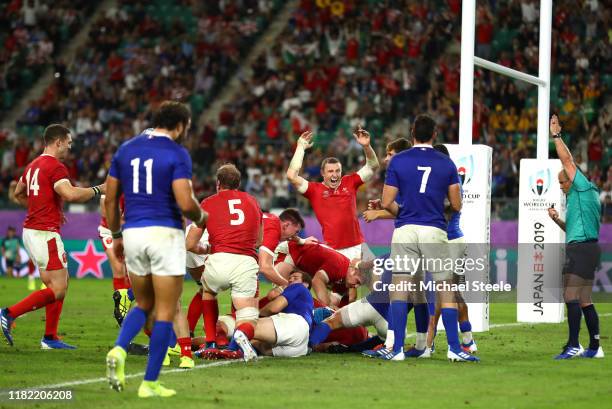 Wales celebrates after Ross Moriarty of Wales scores their team's second try during the Rugby World Cup 2019 Quarter Final match between Wales and...