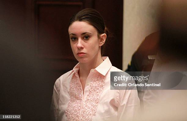 Casey Anthony stands for the arrival of the jury at the start of the second day of jury deliberations in her murder trial at the Orange County...