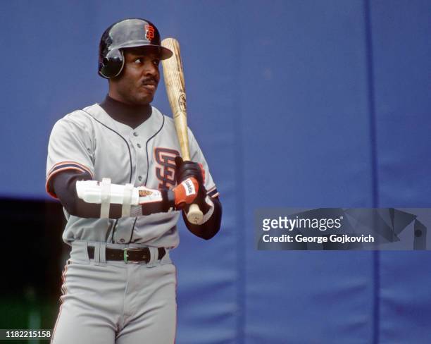 Barry Bonds of the San Francisco Giants looks on from on deck as he waits to bat against the Pittsburgh Pirates during a Major League Baseball game...