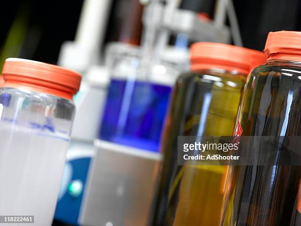 chemical bottles - solutions chemistry stock pictures, royalty-free photos & images