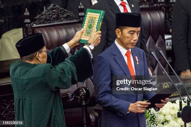 President Joko Widodo is sworn in during his inauguration ceremony at the House of Representative building on October 20, 2019 in Jakarta, Indonesia....