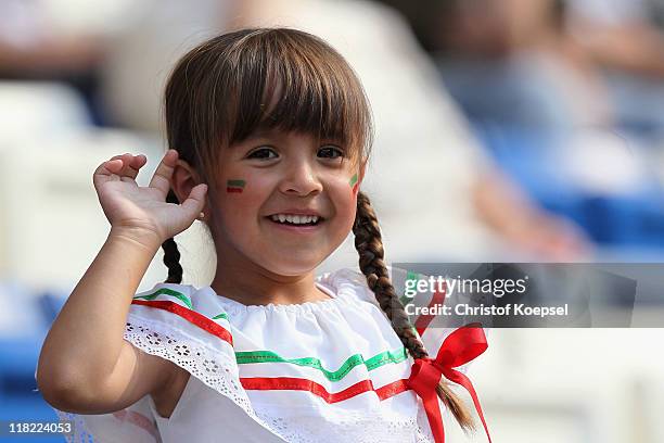 Young fan of Mexico looks on prior to the FIFA Women's World Cup 2011 Group B match between New Zealand and Mexico at Rhein-Neckar Arena on July 5,...