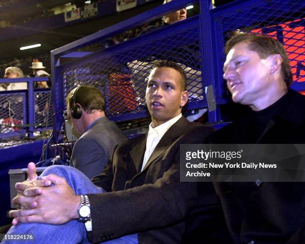 Alex Rodriguez of Seattle Mariners watches game with Scott Boras at Game 4, World Series at Shea Stadium.