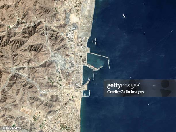 Oil tankers and bulk carriers moored along Fujairah offshore anchorage area on the Gulf of Oman, United Arab Emirates.