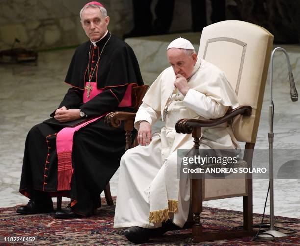 Pope Francis , sitting next to of Prefect the Papal household, Georg Gaenswein, ponders during an audience with students and teachers of Roma's LUMSA...