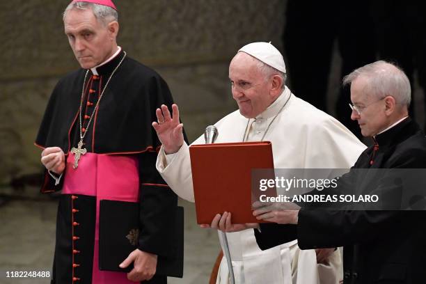 Pope Francis , flanked by Prefect the Papal household, German Archbishop Georg Gaenswein and Argentine priest, monsignor Luis Maria Rodrigo Ewart,...