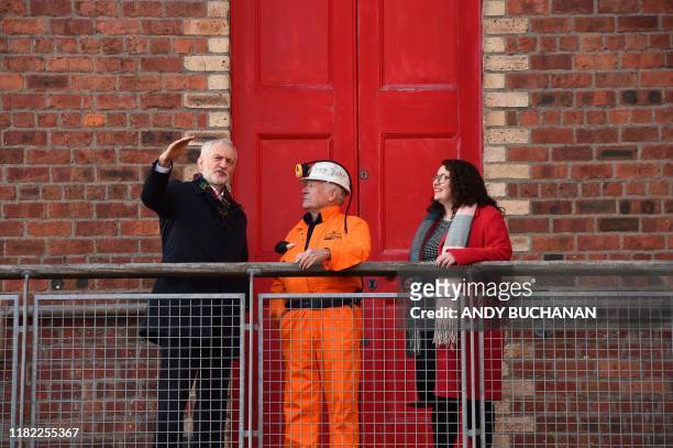 Britain's main opposition Labour Party leader Jeremy Corbyn chats to former miner John Kane and local Labour candidate Danielle Rawley during his...