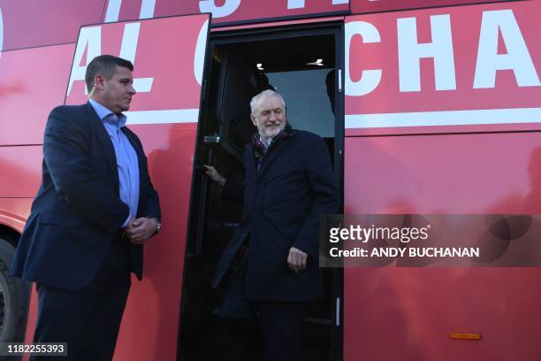 Britain's main opposition Labour Party leader Jeremy Corbyn exits his campaign bus during his visit to the National Mining Museum in Newingtongrace,...