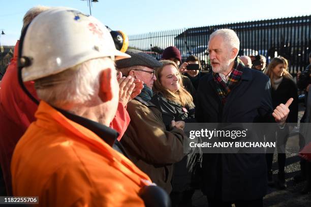 Britain's main opposition Labour Party leader Jeremy Corbyn talks to supporters during his election campaign visit to the National Mining Museum in...