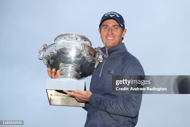 Nicolas Colsaerts of Belgium celebrates with the trophy following Day 4 of the Open de France at Le Golf National on October 20, 2019 in Paris,...