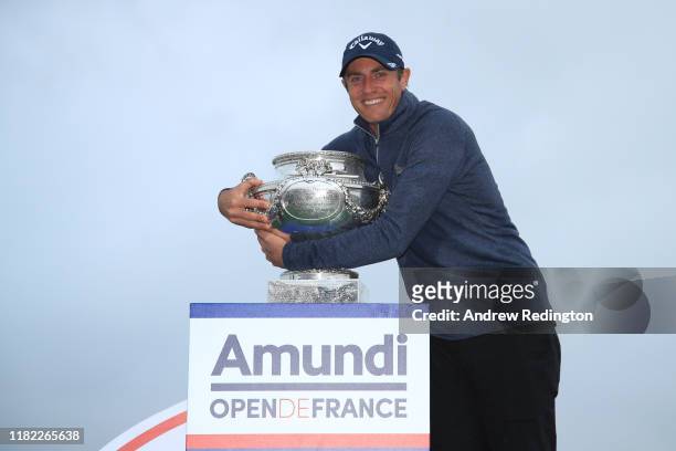 Nicolas Colsaerts of Belgium celebrates with the trophy following Day 4 of the Open de France at Le Golf National on October 20, 2019 in Paris,...