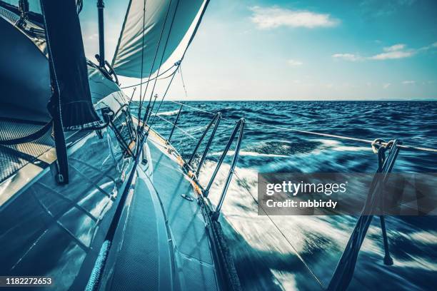 sailing with sailboat at sunset - regata imagens e fotografias de stock