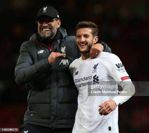 Manager Jurgen Klopp and Adam Lallana of Liverpool walk off after the Premier League match between Manchester United and Liverpool FC at Old Trafford...