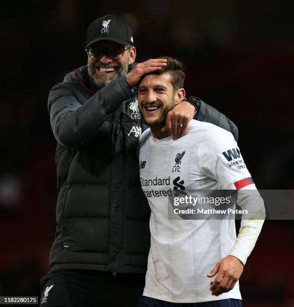 Manager Jurgen Klopp and Adam Lallana of Liverpool walk off after the Premier League match between Manchester United and Liverpool FC at Old Trafford...