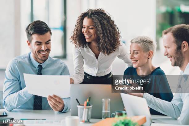 executive directors looking at financial reports - leadership stock pictures, royalty-free photos & images