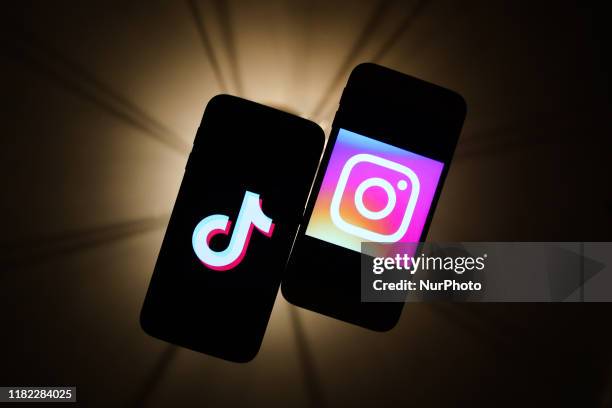 TikTok and Instagram logos are seen displayed on a phone screens in this illustration photo taken in Krakow, Poland on November 14, 2019.