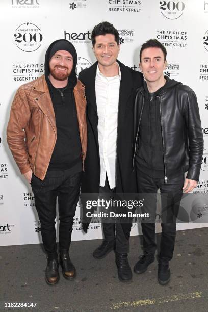 Mark Sheehan, Danny O'Donoghue and Glen Power of The Script attend the switch on of 'The Spirit of Christmas' lights display on Regent Street on...