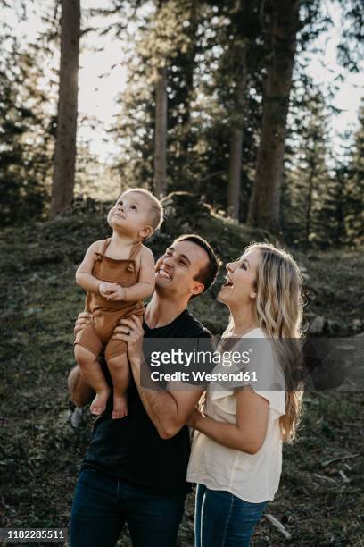 happy family with little son on a hiking trip in a forest, schwaegalp, nesslau, switzerland - baby on the move stock pictures, royalty-free photos & images