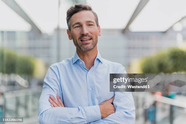 portrait of a confident businessman - guy stubble stock pictures, royalty-free photos & images