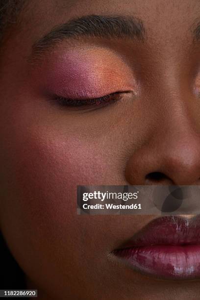 portrait of african woman, closed eye, close-up, made up - blusher stock-fotos und bilder