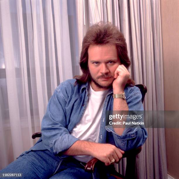 Portrait of American Country musician Travis Tritt as he poses at the Ritz Carlton, Chicago, Illinois, September 5, 1982.