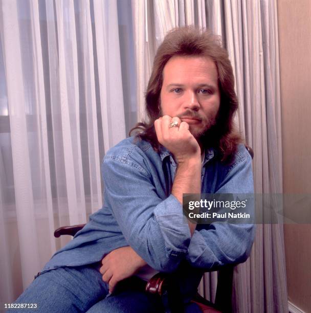 Portrait of American Country musician Travis Tritt as he poses at the Ritz Carlton, Chicago, Illinois, September 5, 1982.