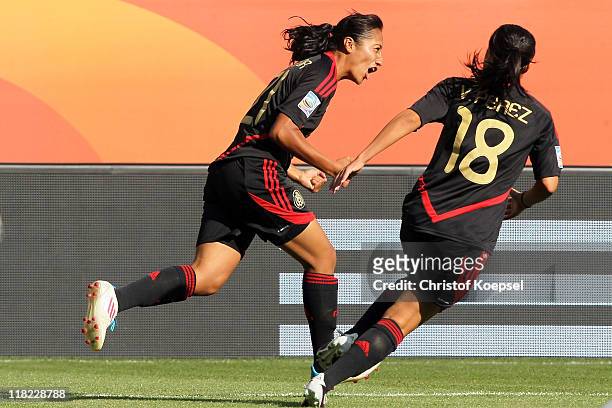 Stephany Mayor of Mexico celebrates the first goal with Veronica Perez of Mexico during the FIFA Women's World Cup 2011 Group B match between New...