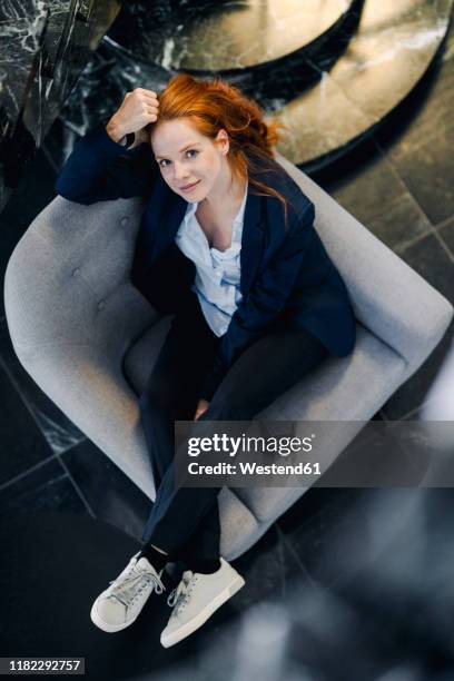 top view of businesswoman sitting in armchair - person look up from above stock pictures, royalty-free photos & images