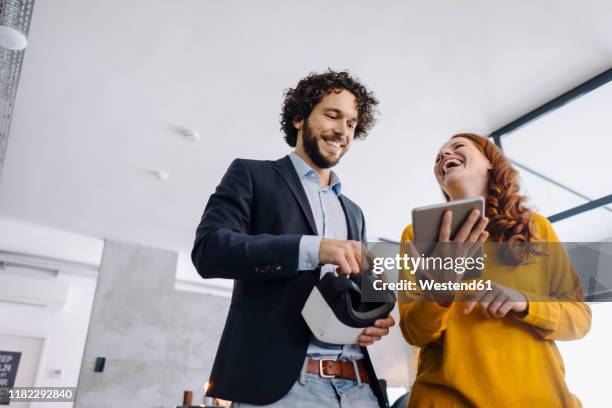 happy businessman and businesswoman with vr glasses and tablet in office - new colleague stock pictures, royalty-free photos & images