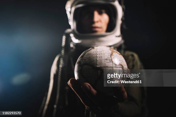 man posing dressed as an astronaut in skyrocket elevator - astronaut hand stock pictures, royalty-free photos & images