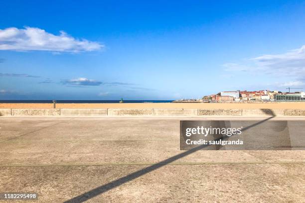 street light shadow against the beach - beach club stock pictures, royalty-free photos & images