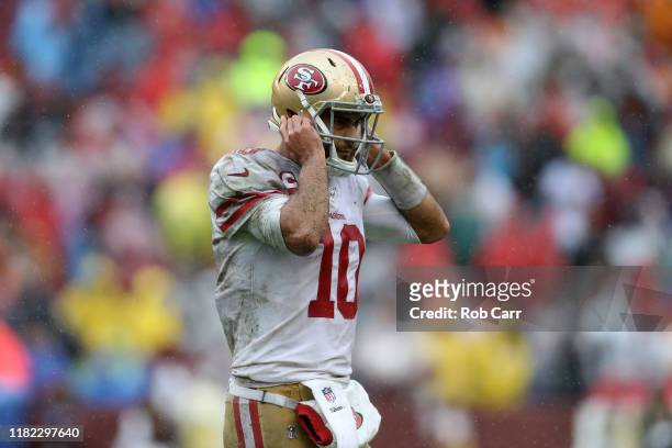 Jimmy Garoppolo of the San Francisco 49ers reacts after a play against the Washington Redskins during the first half in the game at FedExField on...