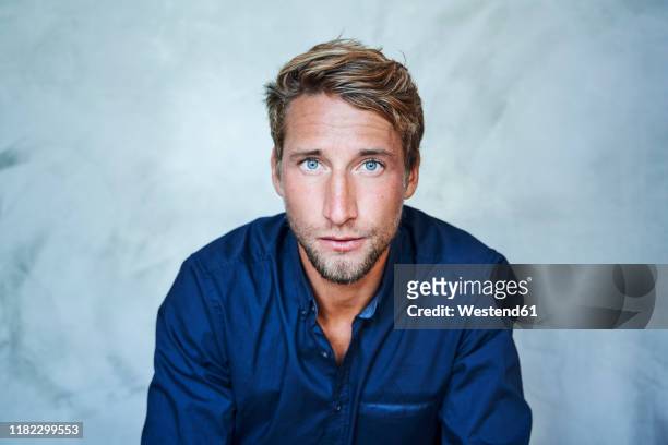 portrait of confident young man - male blue eyes stock pictures, royalty-free photos & images