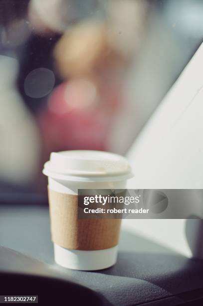 paper coffee cup on car dash board - coffee to go cups stock pictures, royalty-free photos & images