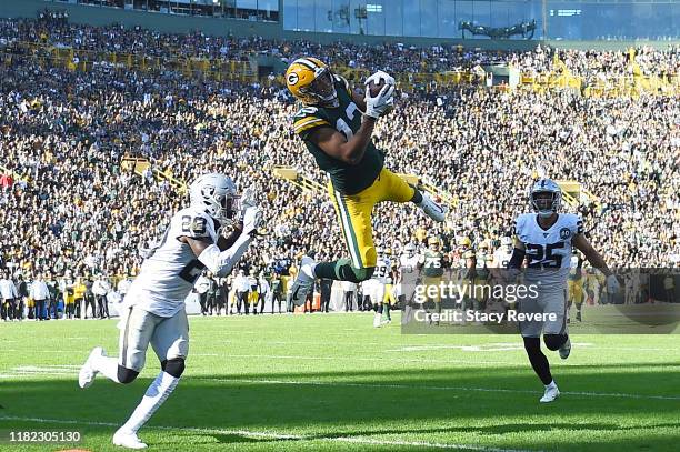 Allen Lazard of the Green Bay Packers catches a pass in front of Daryl Worley of the Oakland Raiders during the third quarter of a game at Lambeau...