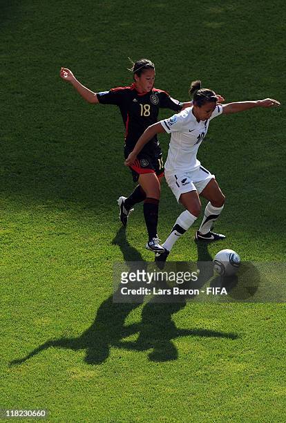 Veronica Perez of Mexico challenges Sarah Gregorius of New Zealand during the FIFA Women's World Cup 2011 Group B match between New Zealand and...