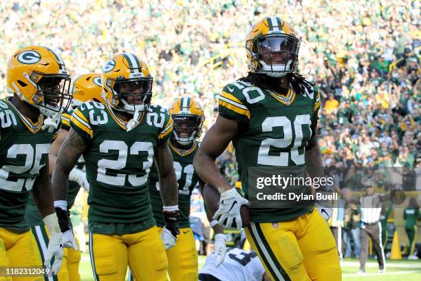 Kevin King of the Green Bay Packers celebrates after making an interception in the fourth quarter against the Oakland Raiders at Lambeau Field on...