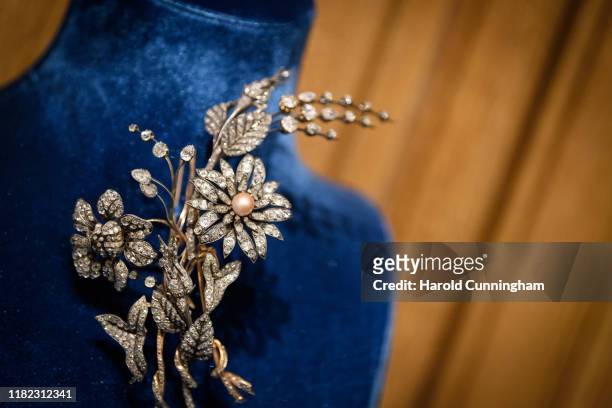Antique Natural Pearl and Diamond Flower Brooch display during the Iskenderian Swiss Red Cross Ball and VIP Party on October 11, 2019 in Geneva,...