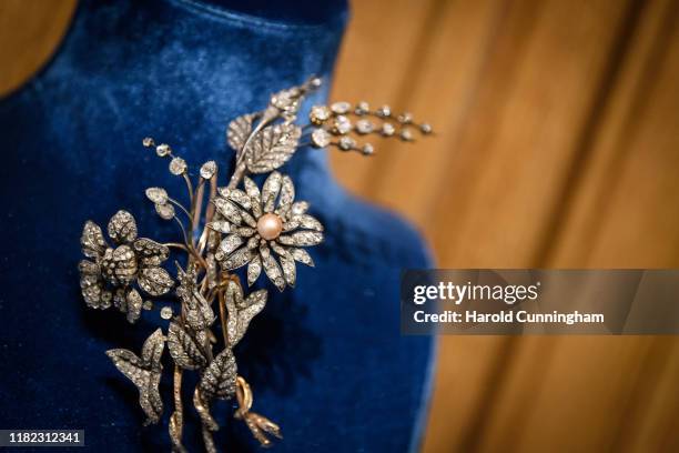 Antique Natural Pearl and Diamond Flower Brooch display during the Iskenderian Swiss Red Cross Ball and VIP Party on October 11, 2019 in Geneva,...