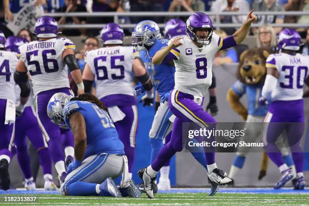 Kirk Cousins of the Minnesota Vikings reacts to a late fourth quarter touchdown run by Dalvin Cook to seal the game against the Detroit Lions at Ford...